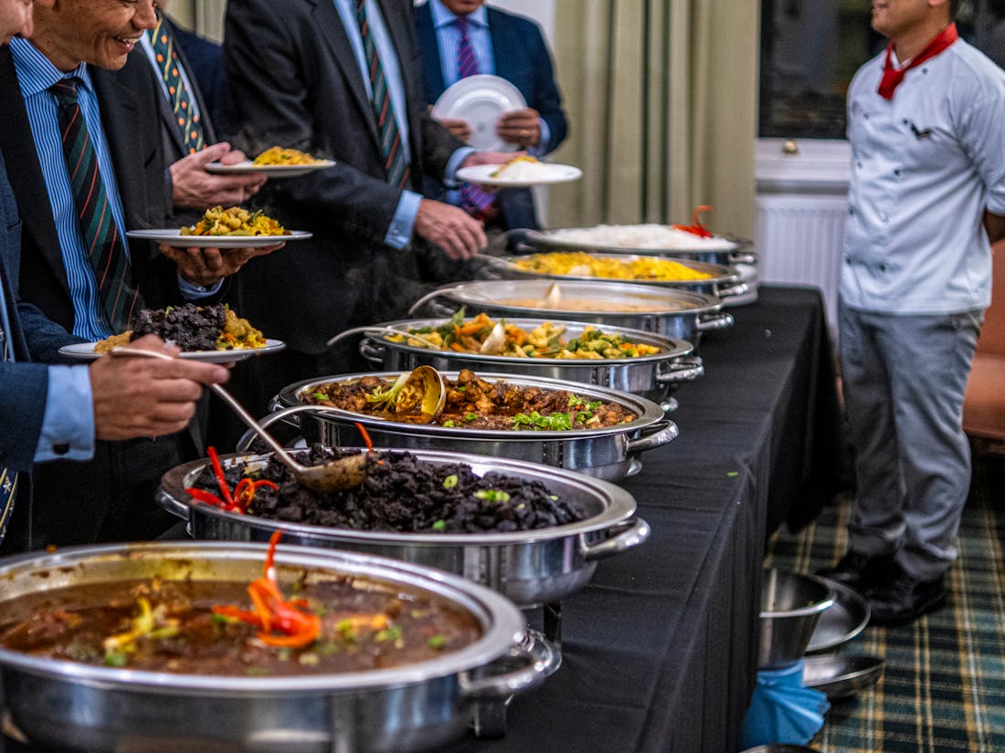 A corporate catering buffet spread set up for a business lunch or conference event.